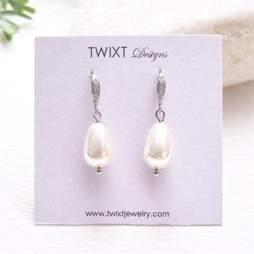 Silver Pearl earrings on a Twixt Designs card with a light background